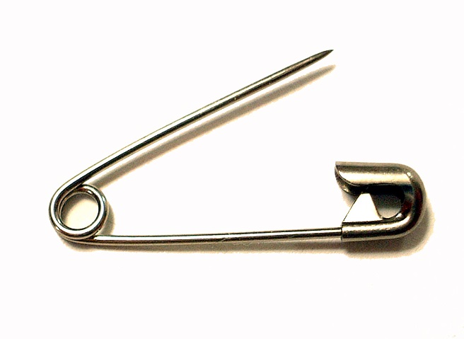 a photograph of an open safety pin